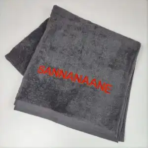 Tikandiga tumehall froteerätik - Saunanaine